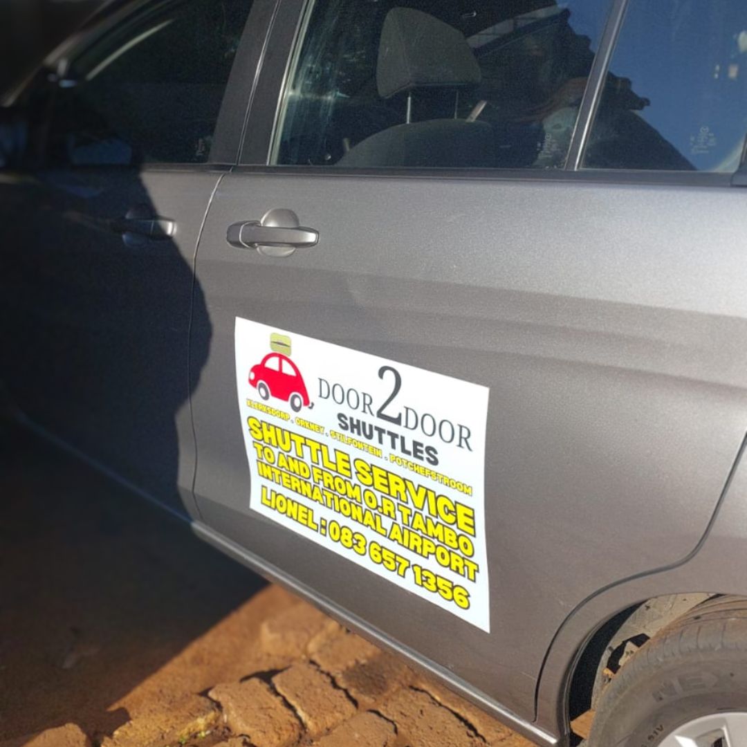 Door2Door Shuttles branded vehicle magnet showing Lionel's contact number